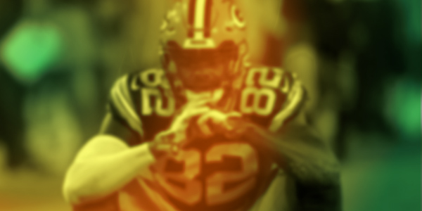 Featured image of J'Mon Moore with a green and gold overlay
